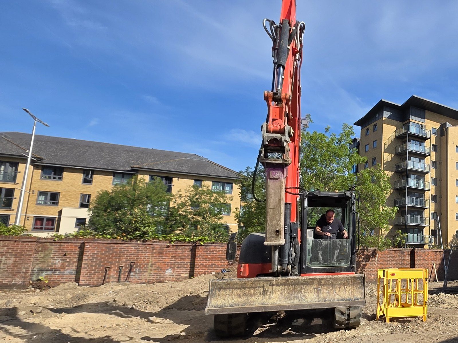 Our digger with a pecker on, breaking out on a site strip
