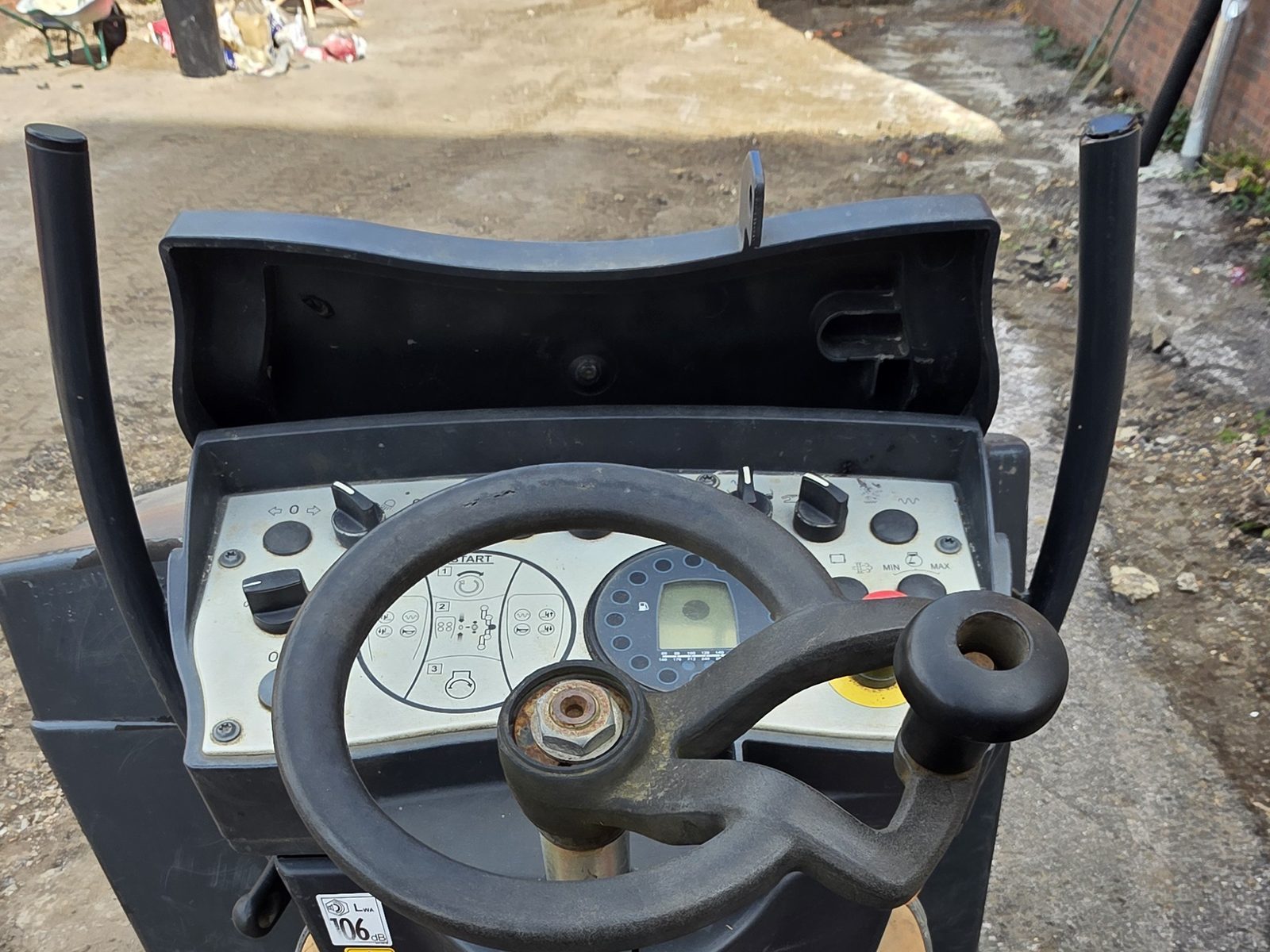 The view from the operator's seat of a ride-on roller